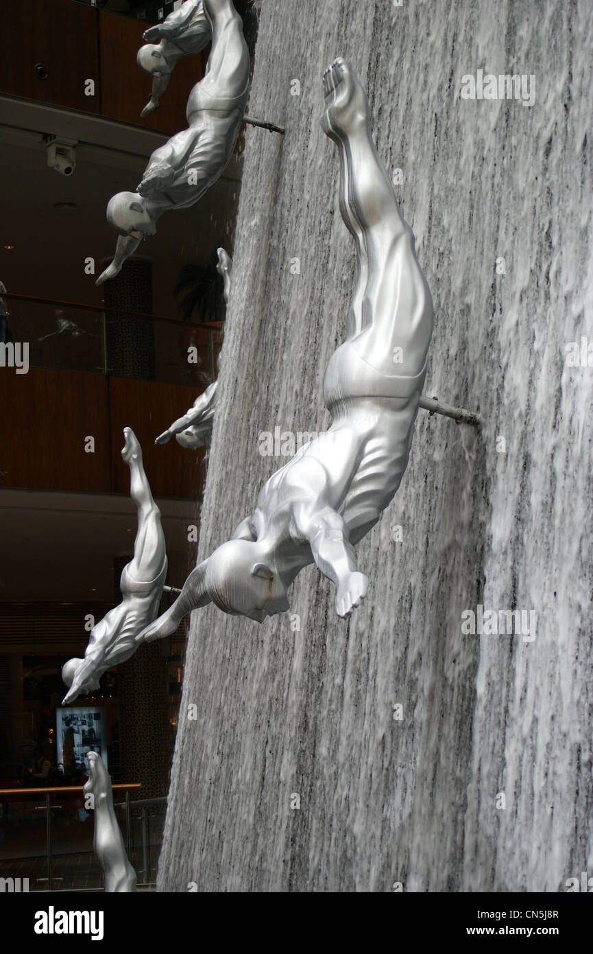 'Waterfall' sculpture with divers by DPPA Architects of Singapore,  Dubai Mall, United Arab Emirates Stock Photo