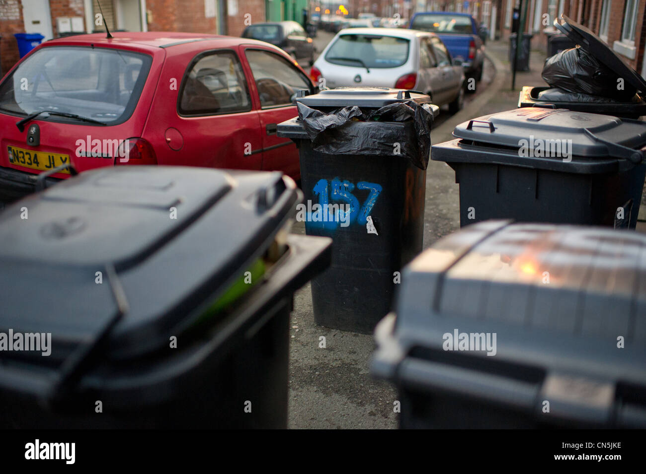 Wheely bins on the pavement blocking the way Stock Photo Alamy