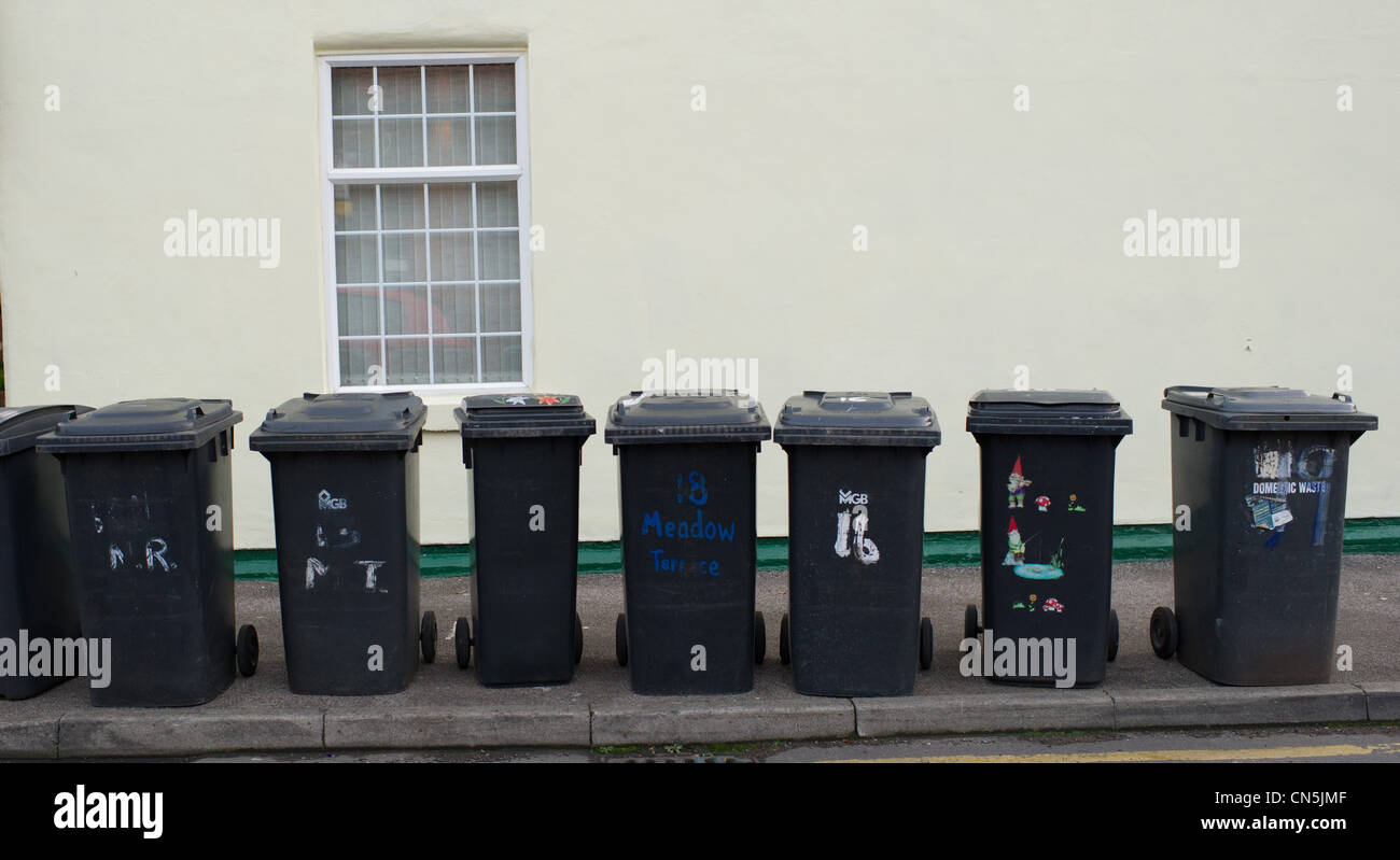 Wheelie bins on the pavement waiting to be emptied Stock Photo Alamy