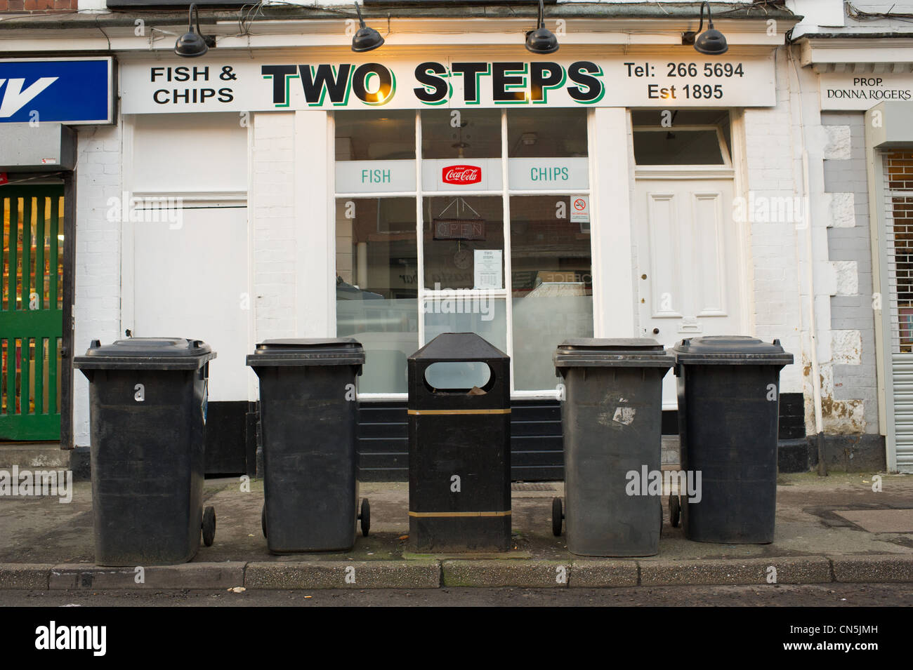 Wheelie bins on the pavement waiting to be emptied Stock Photo Alamy