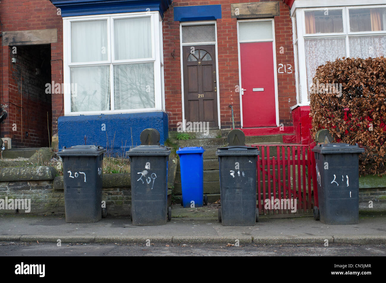 Wheelie bins on the pavement waiting to be emptied Stock Photo Alamy