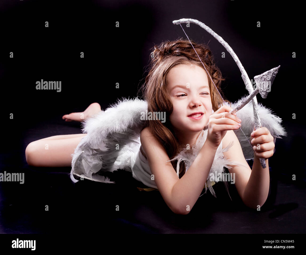 girl wearing a costume of a cupid Stock Photo Alamy