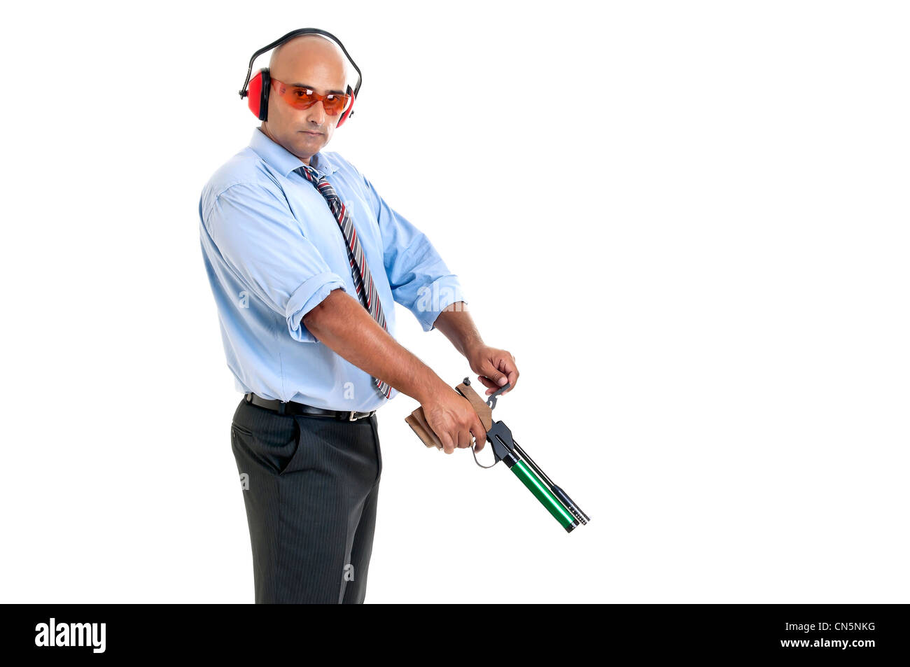 Businessman with compressed air gun Stock Photo