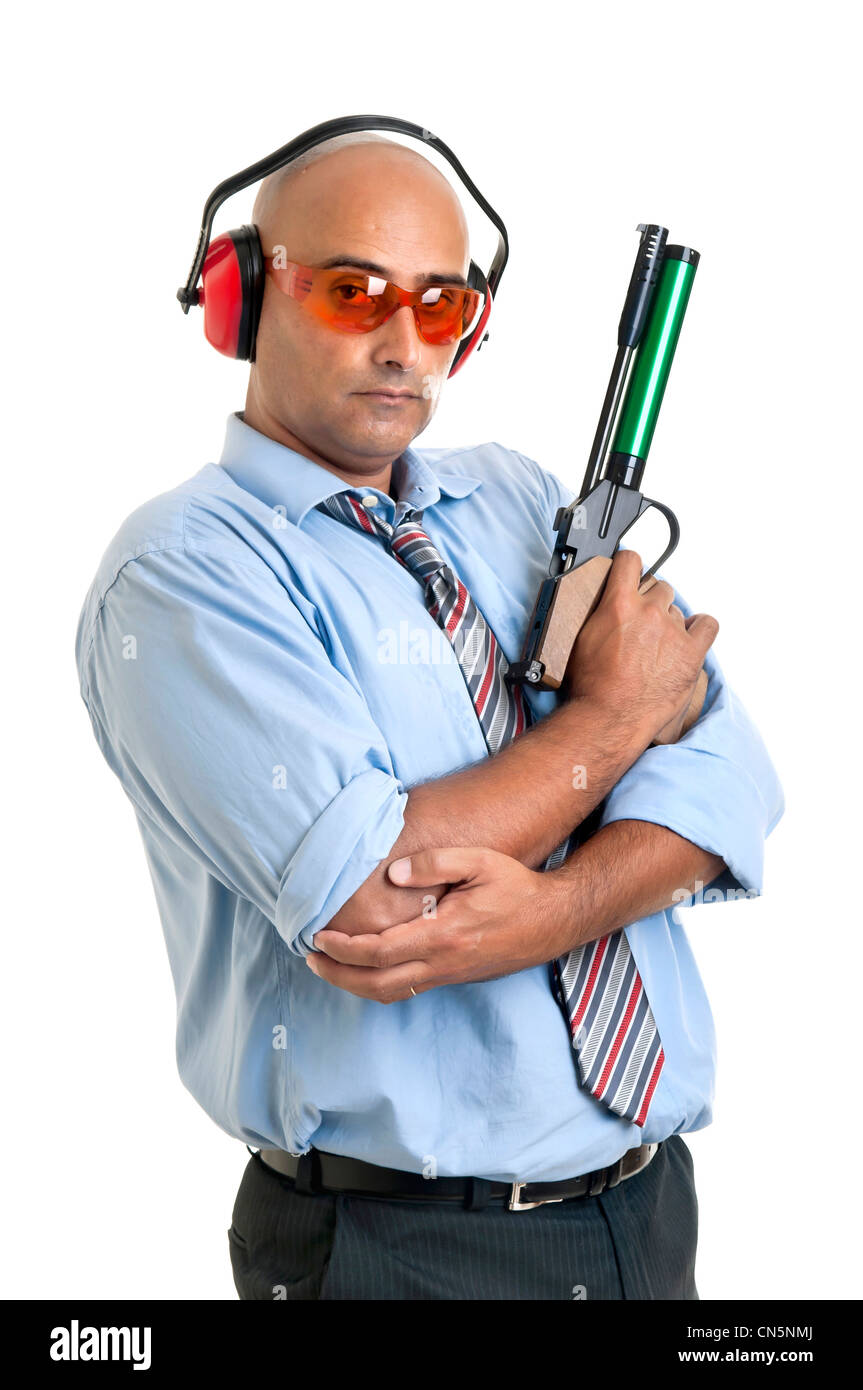 Businessman with compressed air gun Stock Photo