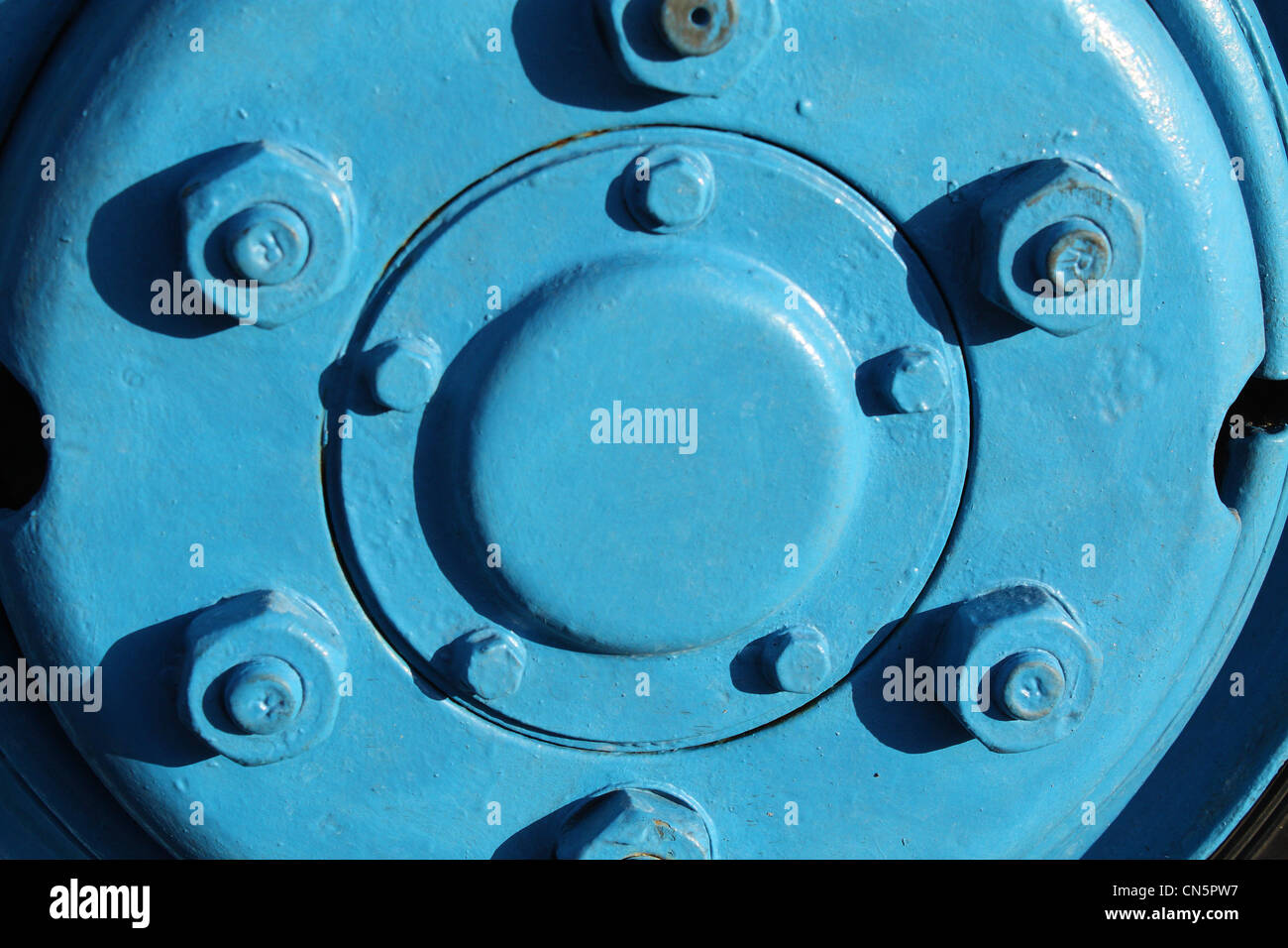 A Close-up of the wheel of a truck of a vivid light blue color. Stock Photo