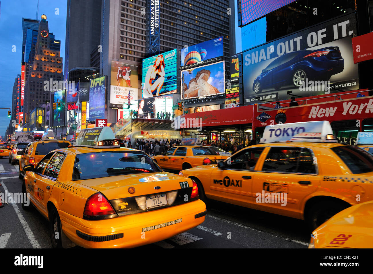 United States, New York City, Manhattan, Theater District on Broadway Avenue, yellow cab in Times Square Stock Photo