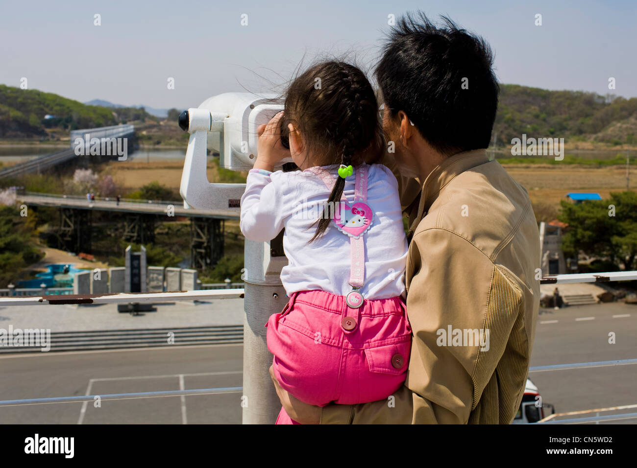 South Korea, Gyeonggi Province, Imjingak, Freedom Bridge, watching at the other side of Freedom Bridge, a South Korean father Stock Photo