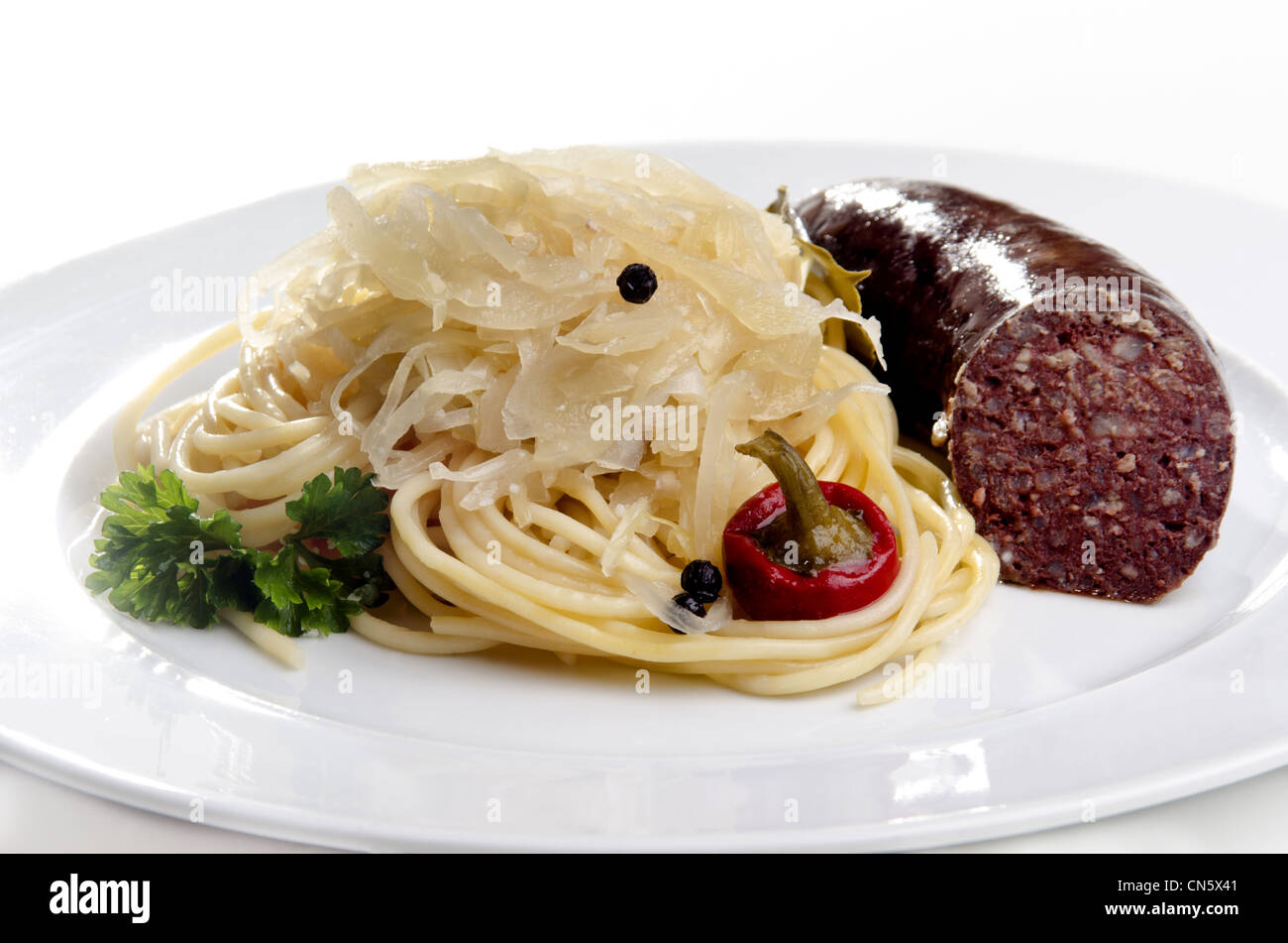 Steamed sauerkraut with grilled pork and spaghetti Stock Photo