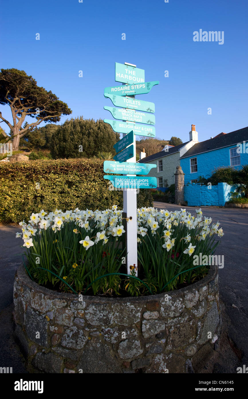 United Kingdom, Channel Islands, Herm Island, direction signs and The Ship Inn restaurant and bar in the background Stock Photo
