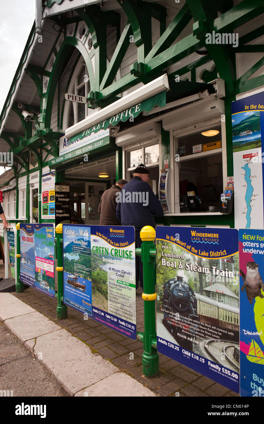 UK, Cumbria, Ambleside, lake Windermere jetty, visitors at boat cruise ticket office Stock Photo