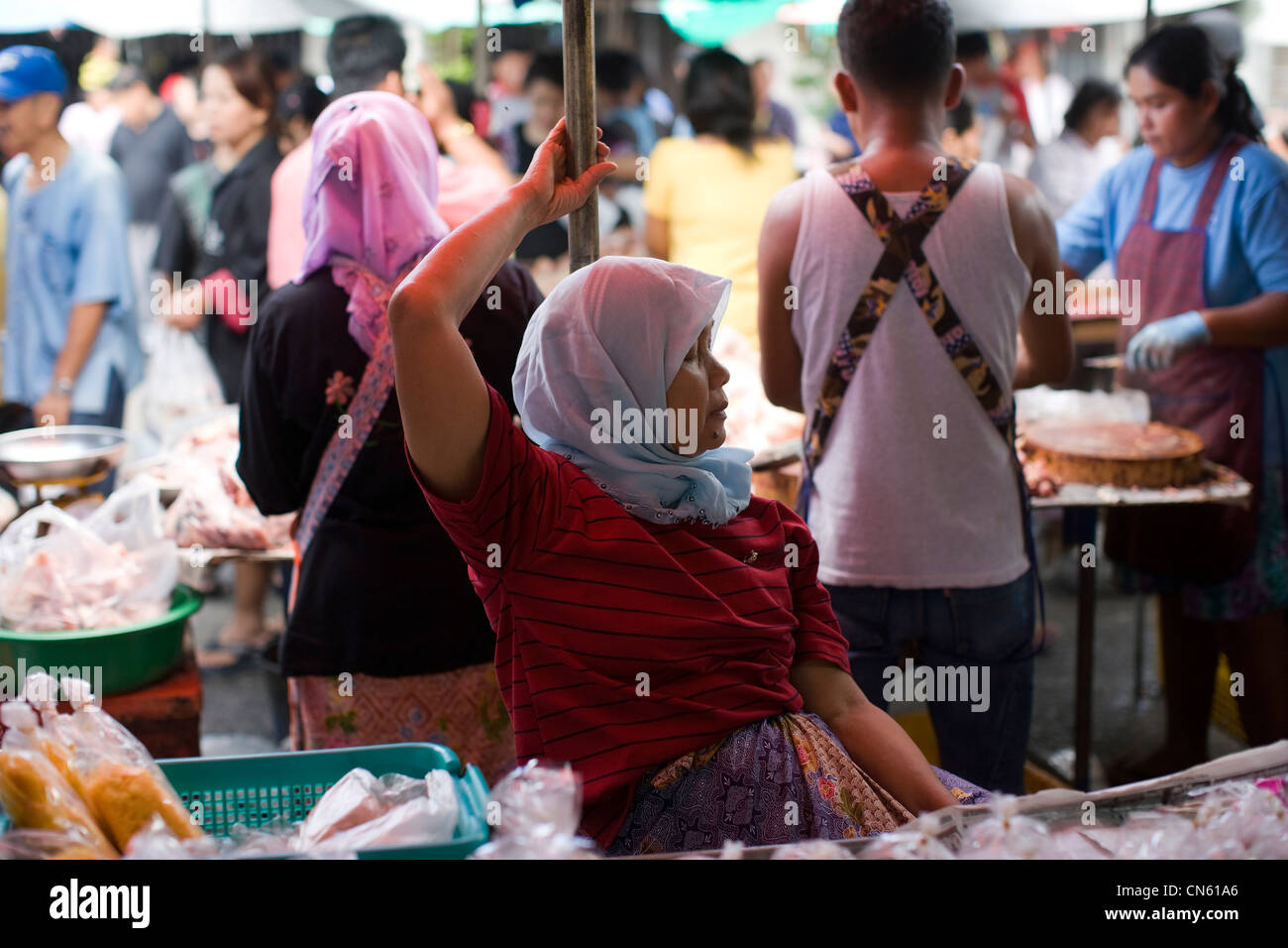 Stall holder at the Central Market waits for customers, Songkhla, Thailand, Jan 2008 Photo by Mike Goldwater Stock Photo