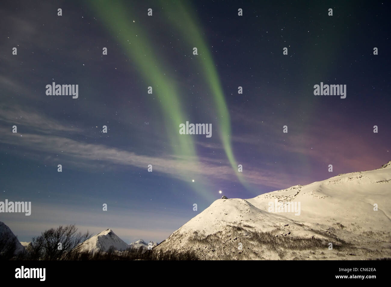 Aurora borealis or northern lights moving across night sky within the ...