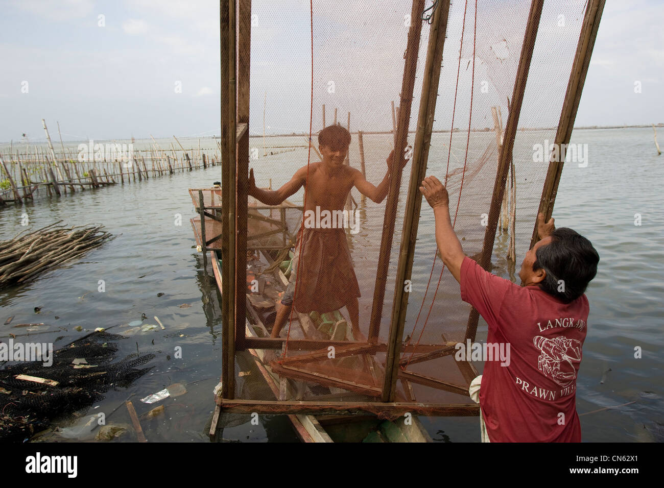 Fisherman making fishing net in hi-res stock photography and images - Alamy