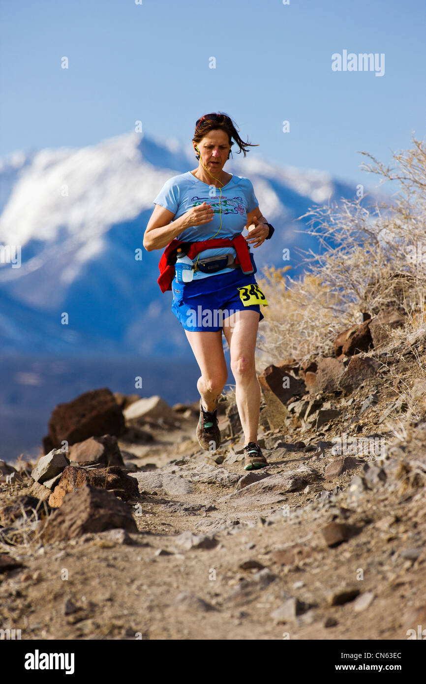 Female runner competes in the Run Through Time Marathon, Salida, Colorado, USA Stock Photo