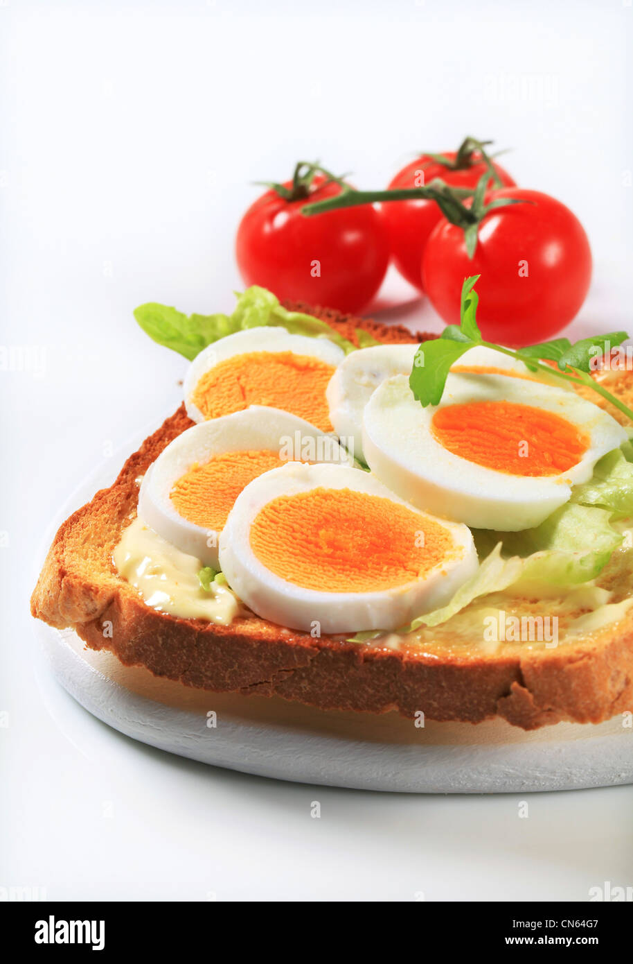 Open faced egg sandwich studio Stock Photo Alamy