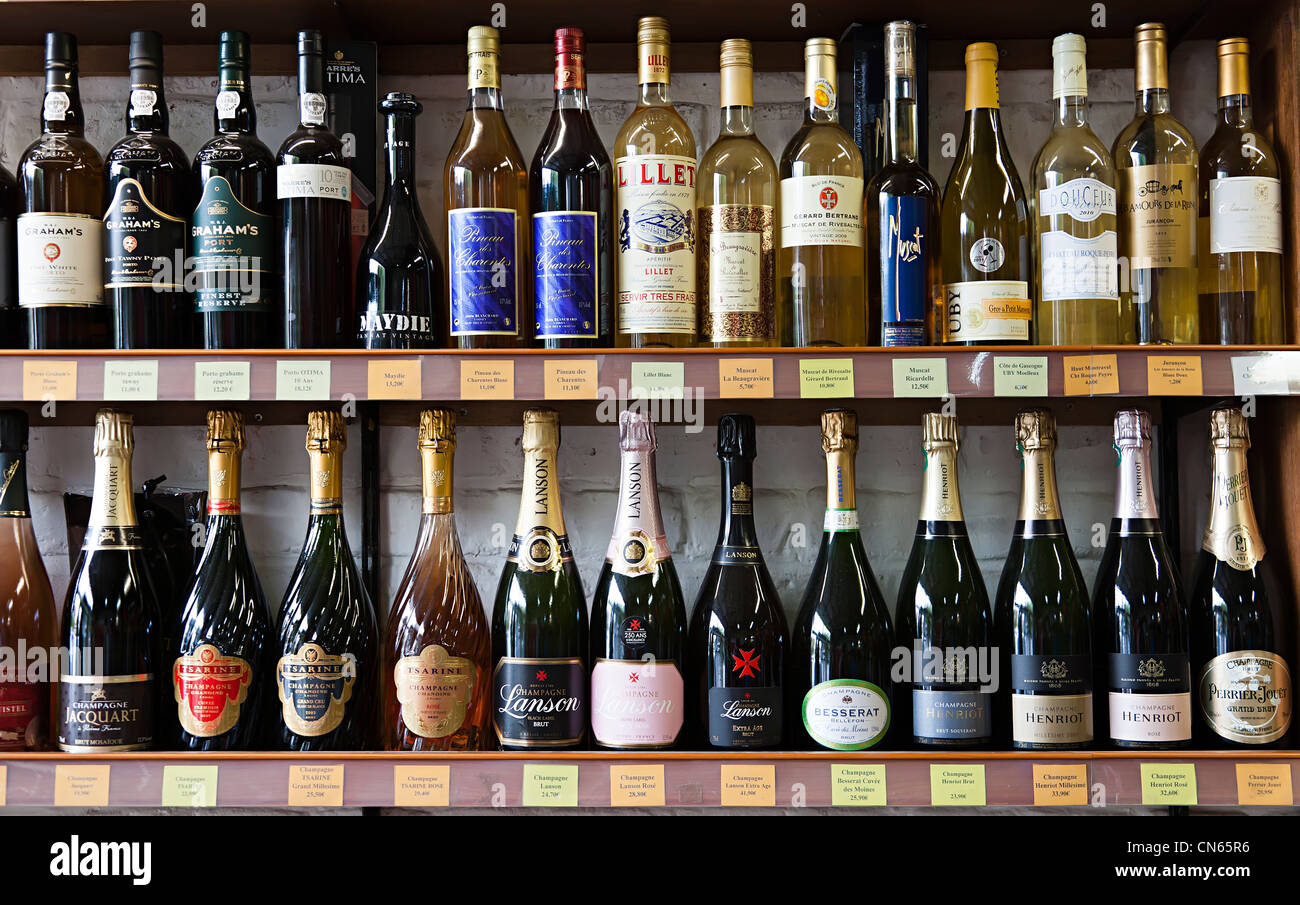 Bottles of port, wine and champagne on sale in French shop, Bergues Stock Photo