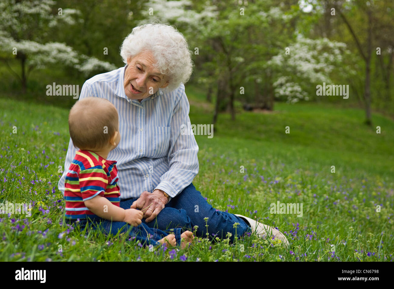 Great Grandmother and Great Grandson Outdoors on a Spring Day Stock Photo
