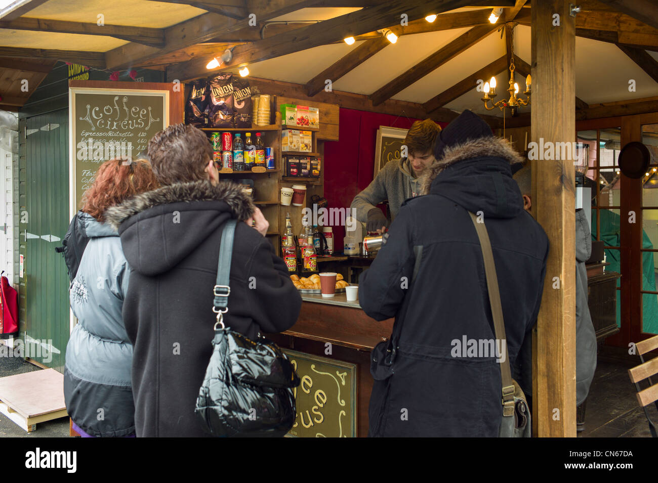 People, tourist, buying food at a food stall in Camden Market, Camden Town, London England Stock Photo