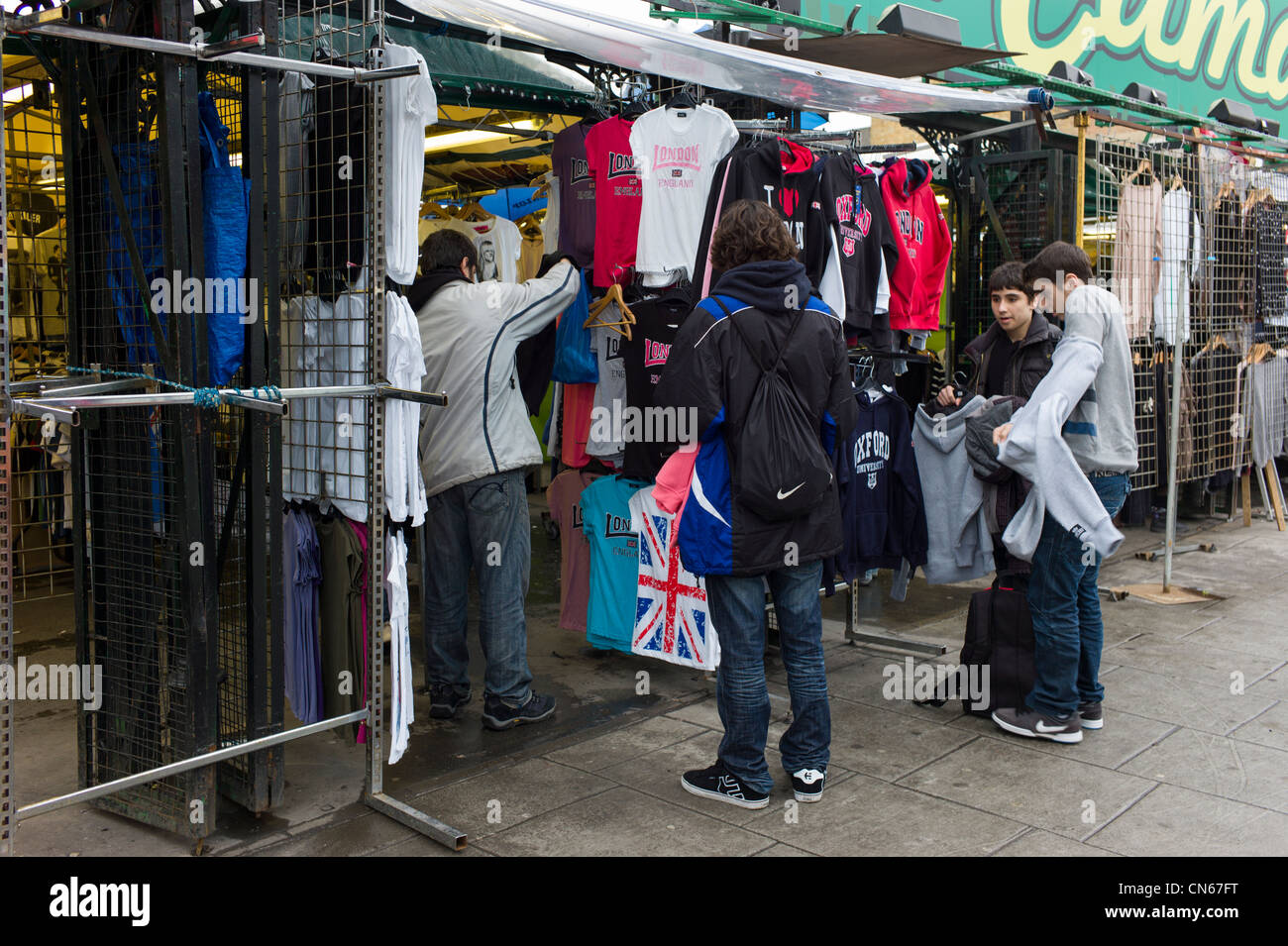 Shoppers, people buying cloths, Camden Market, Camden High Street, London England Stock Photo