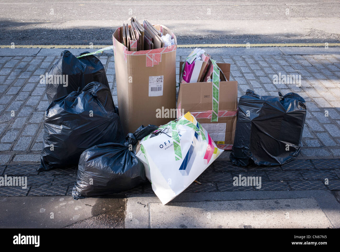 Black rubbish bins, re-cycling, in Camden Market, Camden Town, London, England Stock Photo