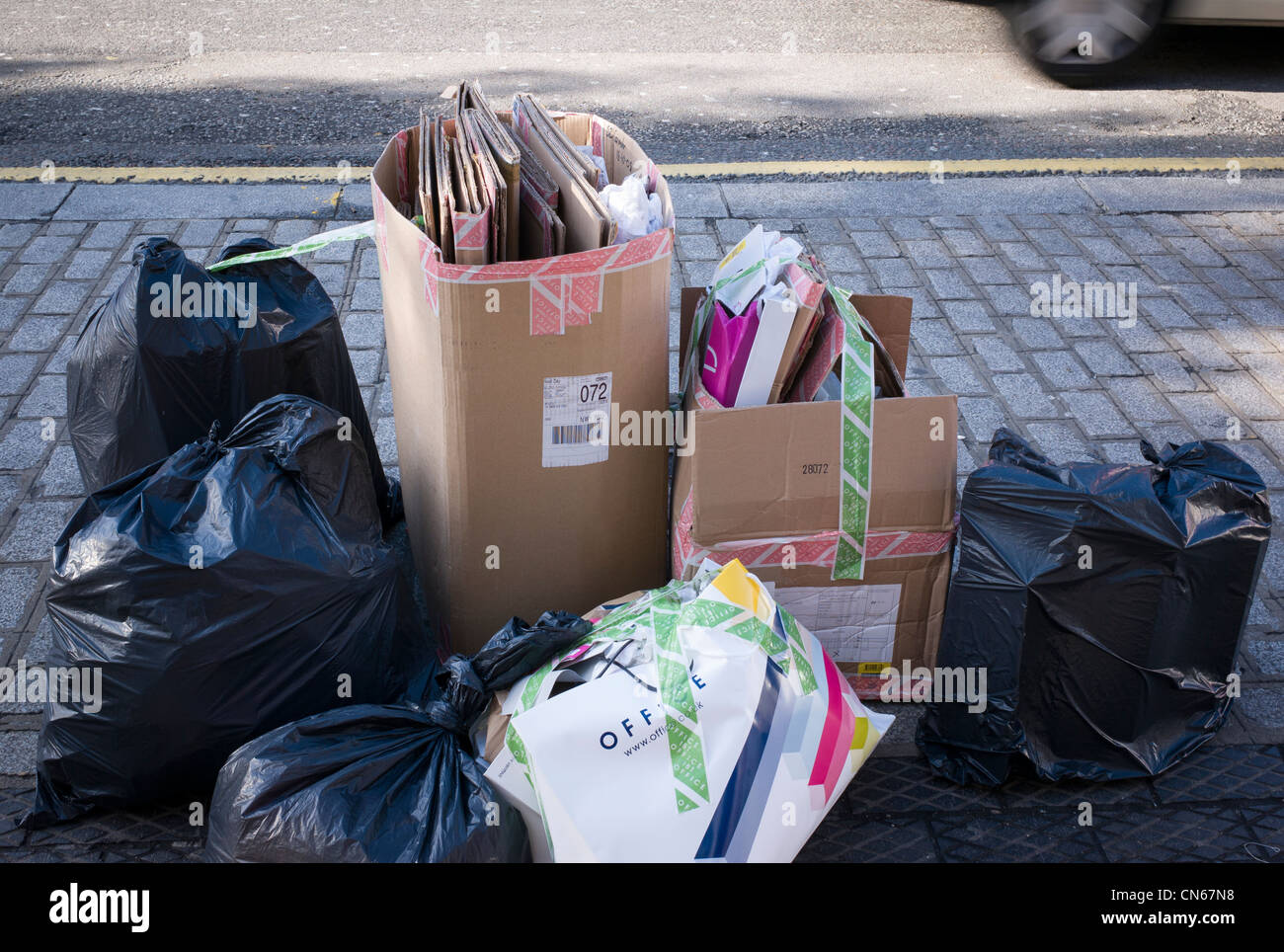 Black rubbish bins, re-cycling, in Camden Market, Camden Town, London, England Stock Photo