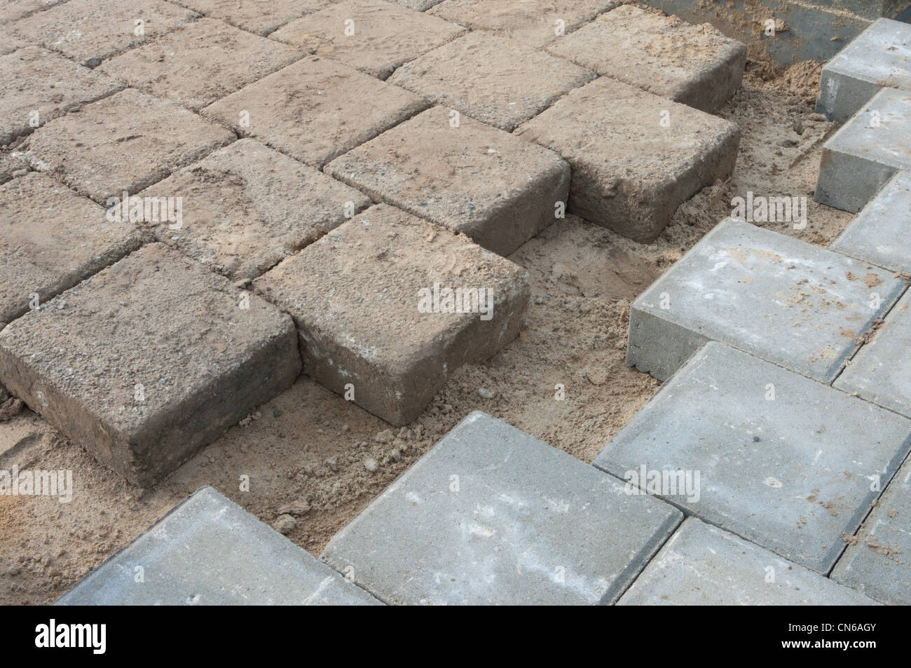 bricks coming together on a newly paved street Stock Photo
