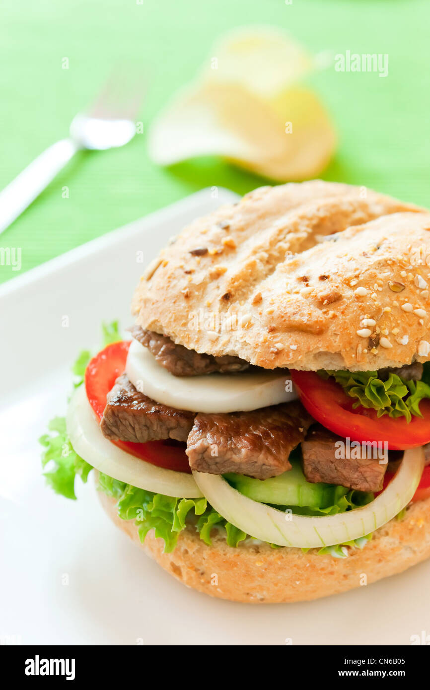 Fresh and healthy sandwich with vegetables and beef sliced Stock Photo