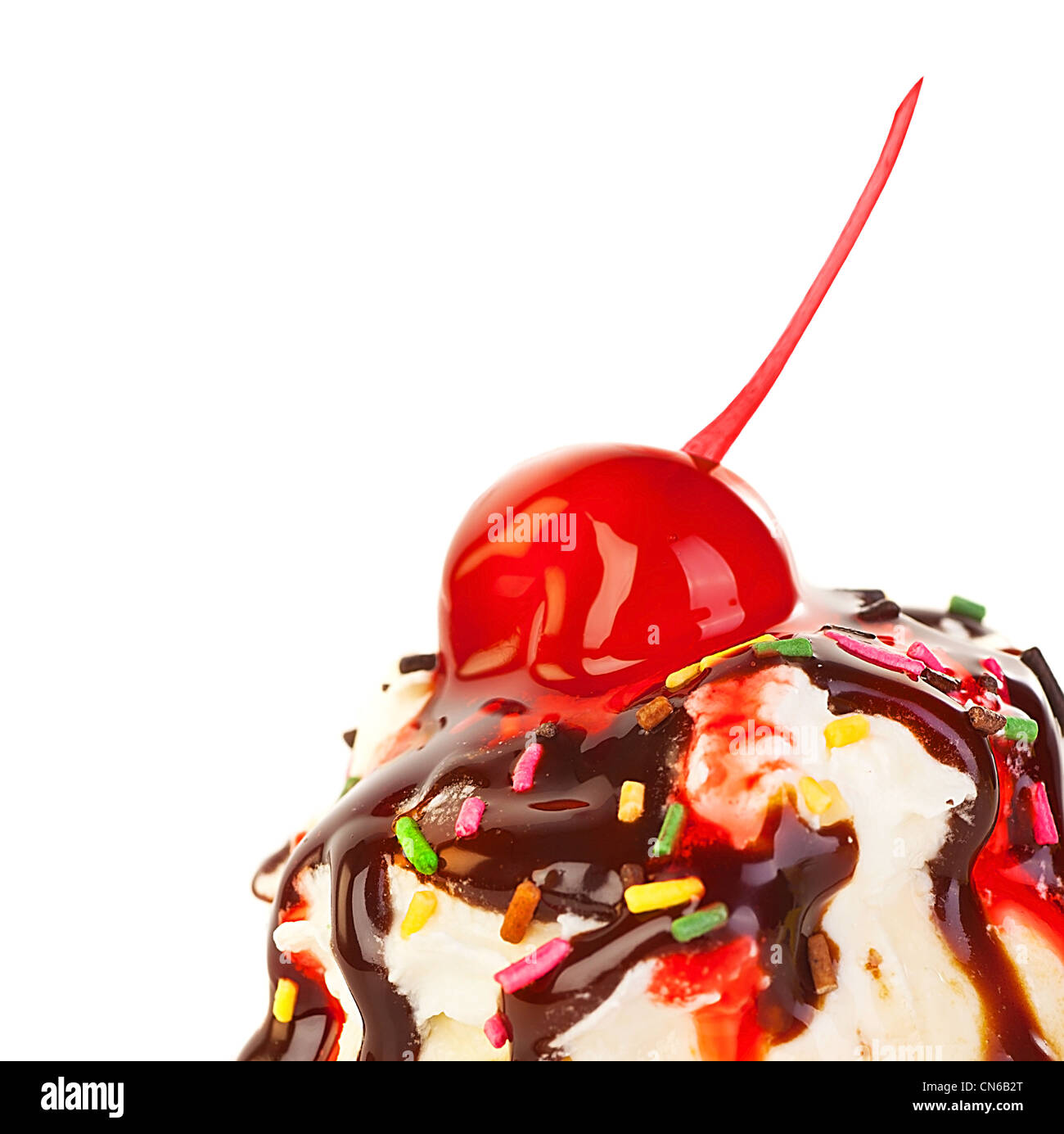 Ice cream border, frozen sweet yogurt topped with chocolate and strawberry syrup, decorated with cherry berry Stock Photo