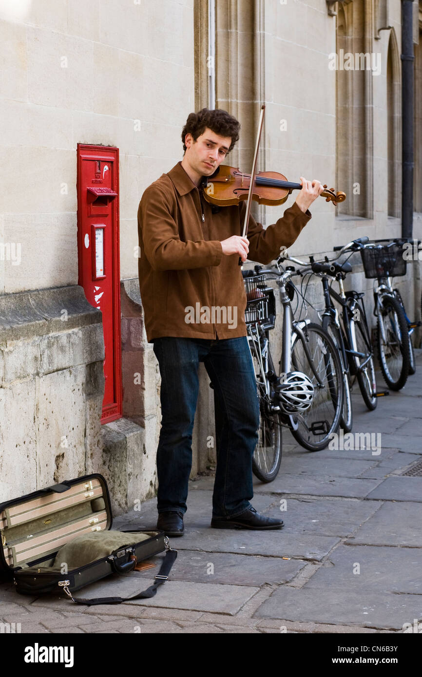 Male busker on the streets of Oxford city. Stock Photo