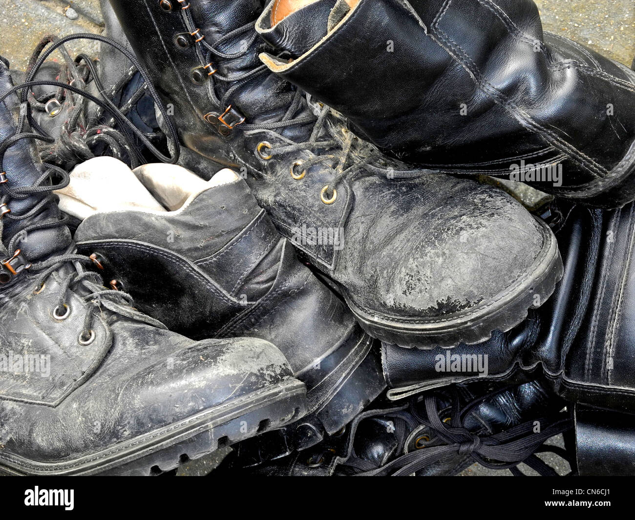 A pile of old boots Stock Photo - Alamy
