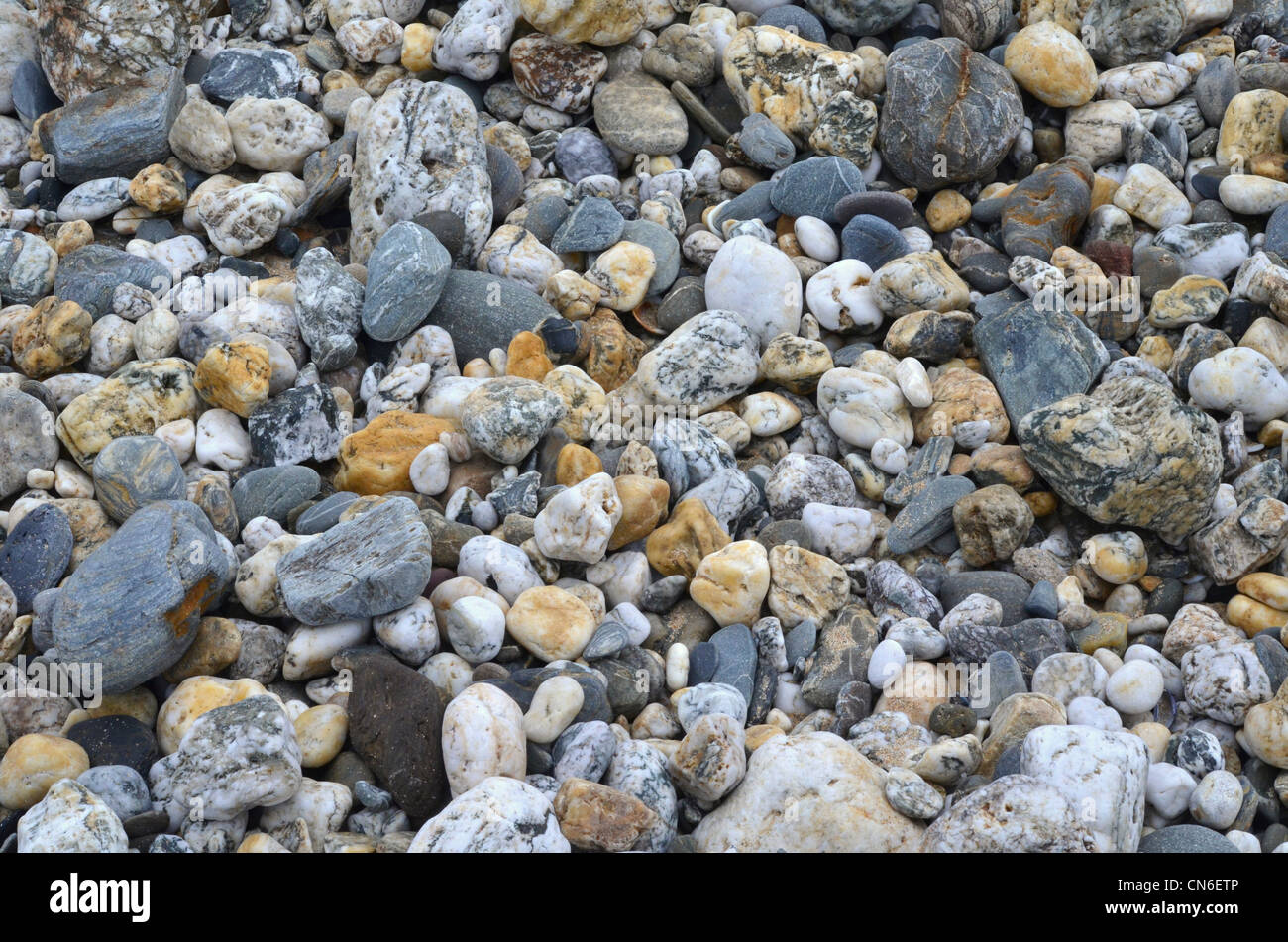 Shingle on beach. Concept 'fall on stony ground', warnings ignored. etc. Also, International Rock Day, small pile of stones, leave no stone unturned. Stock Photo