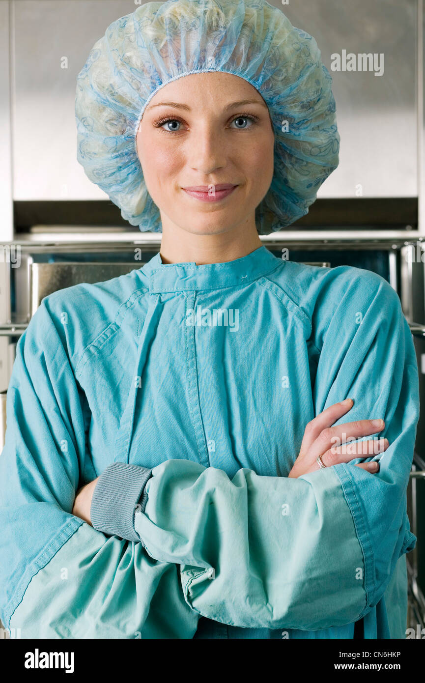 Portrait of a Nurse in Scrubs near a Surgical Equipment Sterilization