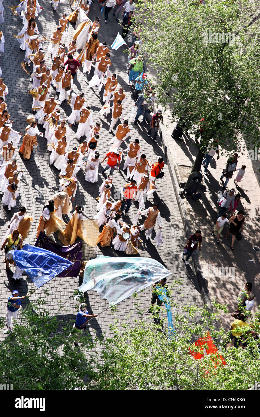 white robed participants in Evangelical March of Glory pass down Cinco de Mayo on way to Zocalo April 7 2012 Mexico City Stock Photo