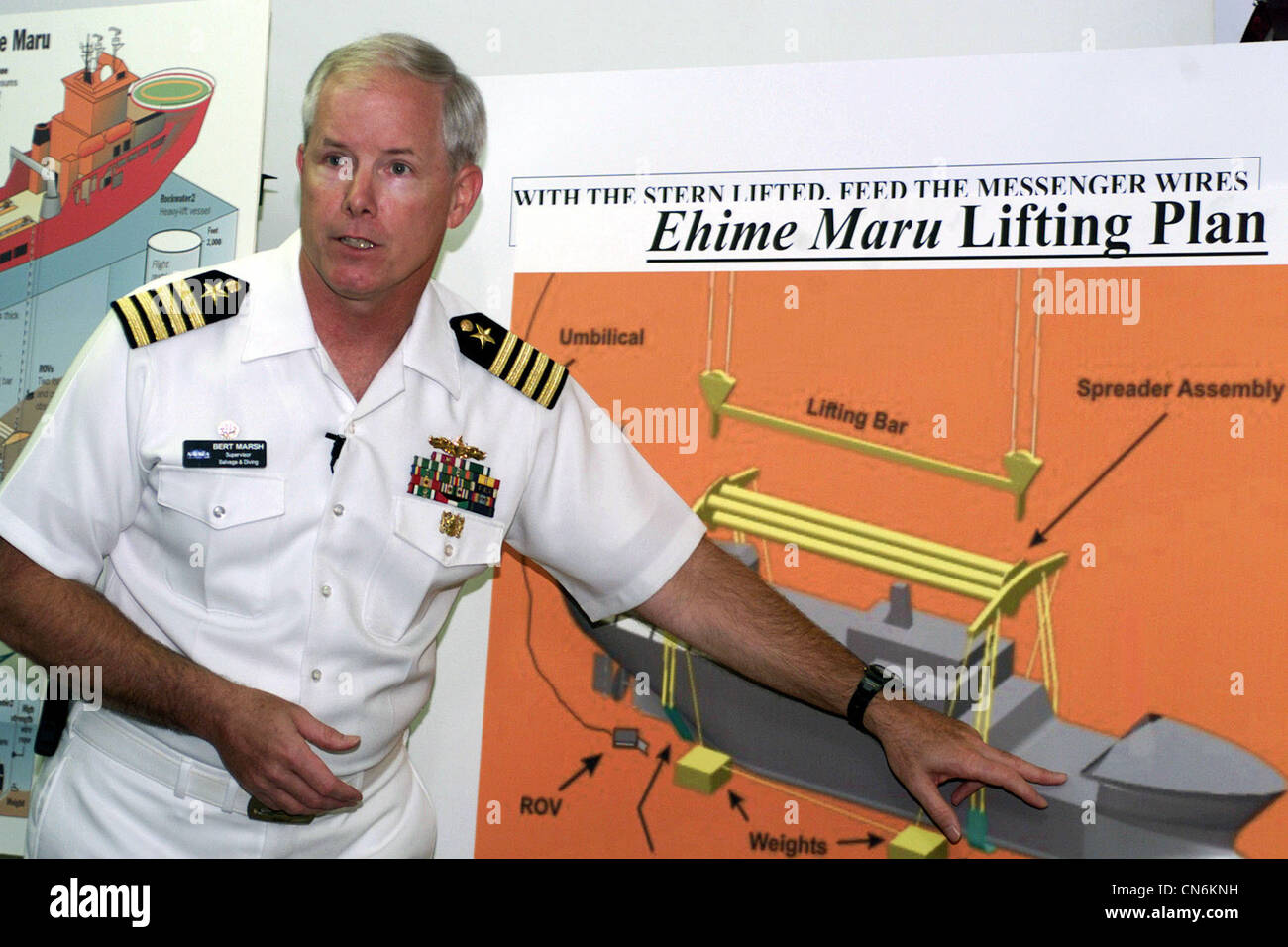 US Navy (USN) Captain (CAPT) Bert Marsh, Director of Ocean Engineering and Supervisor of Salvage and Diving at the Naval Sea Systems Command, uses a chart to describe the lifting process for the Japanese fishing vessel Ehime Maru, during a press briefing. Stock Photo