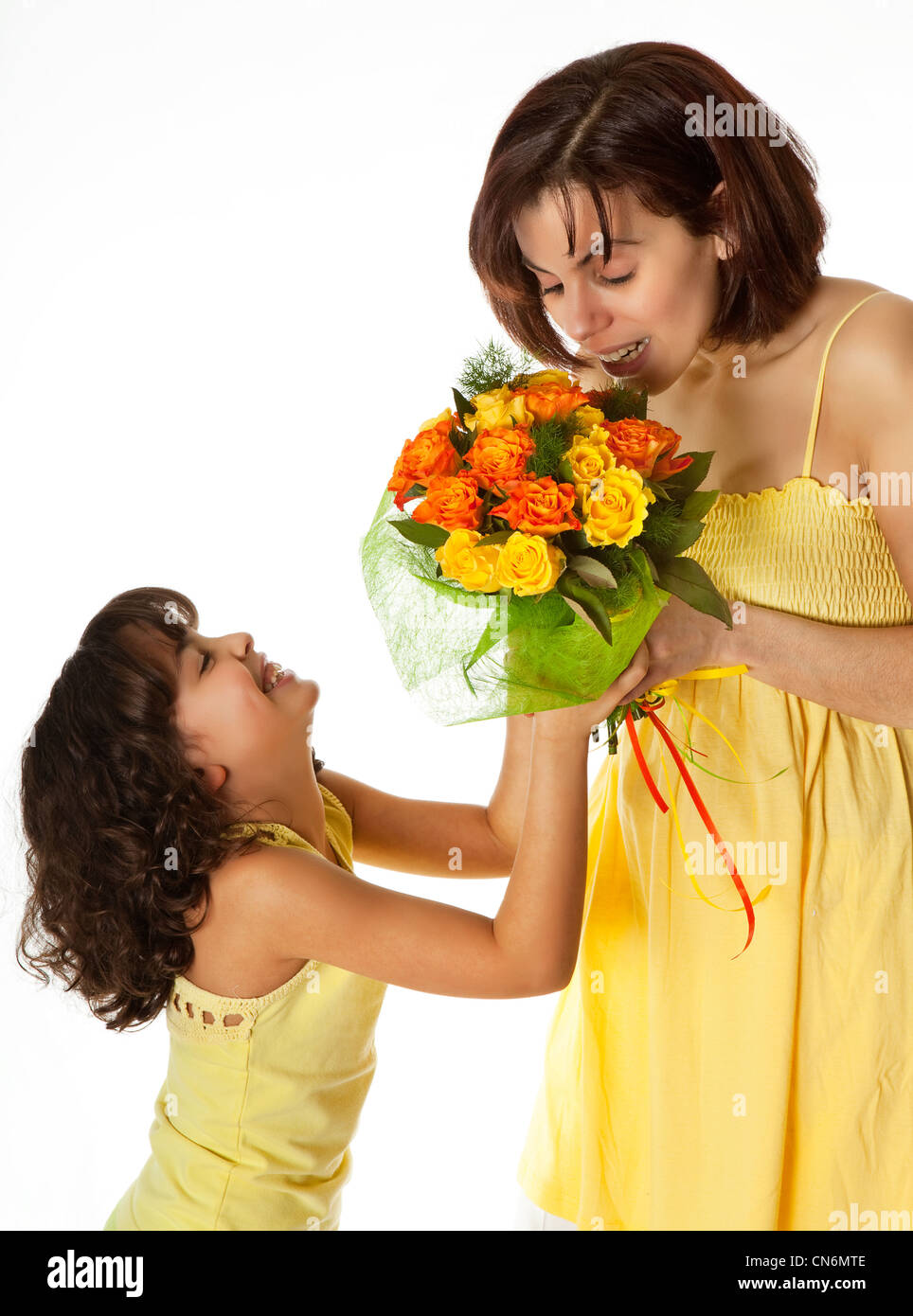 Little girl giving flowers to mom on mother's day Stock Photo Alamy