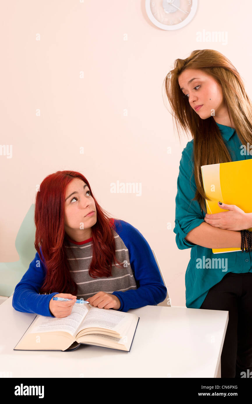 Hostile attitude between two female classmates Stock Photo