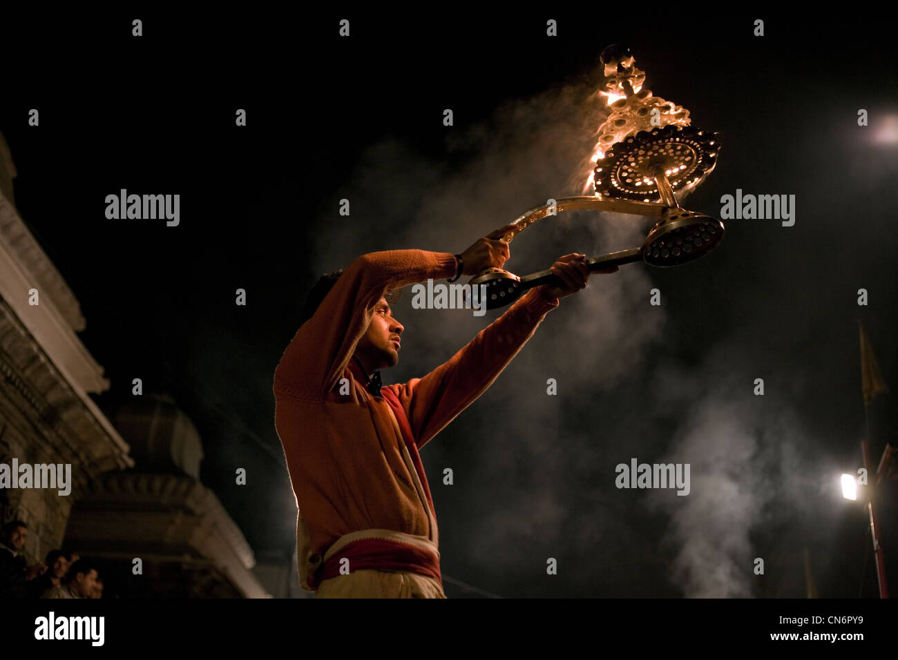 Brahmin  priest performing aarti at Pashupatinath temple , Kathmandu , Nepal Stock Photo