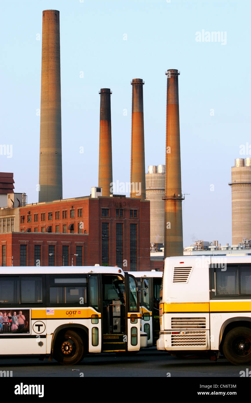 City buses and smoke stacks from an electric generating plant, Boston, Massachusetts Stock Photo