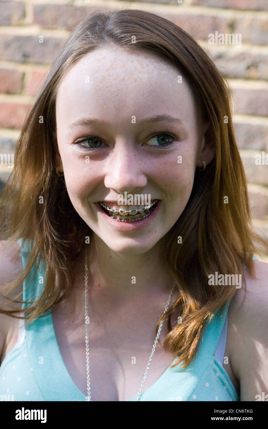 Portrait of smiling teenage girl Stock Photo - Alamy