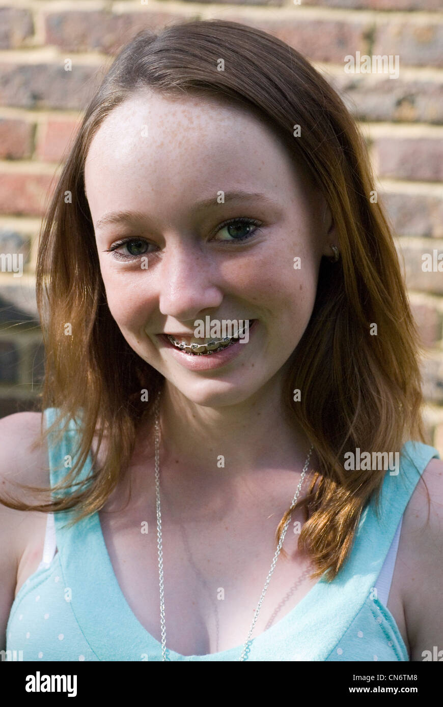 Portrait of smiling teenage girl Stock Photo - Alamy