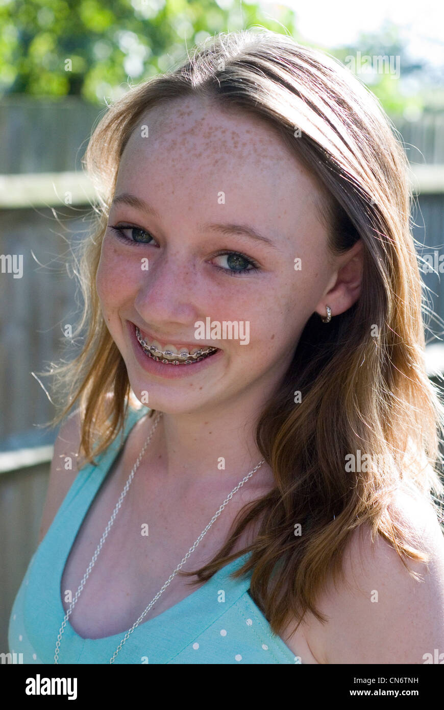 Portrait of smiling teenage girl Stock Photo - Alamy