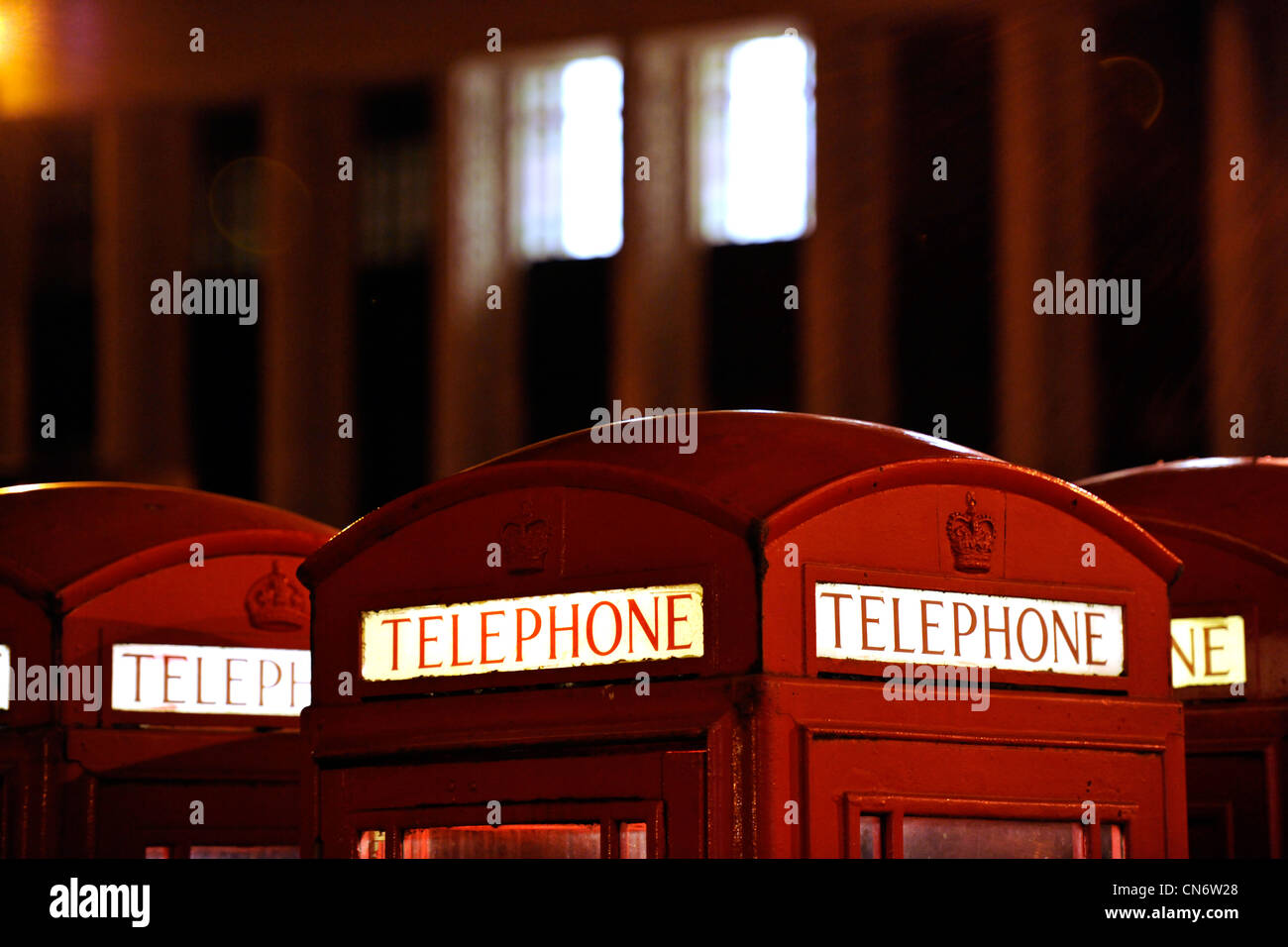 Red telephone box in Durham city at night Stock Photo