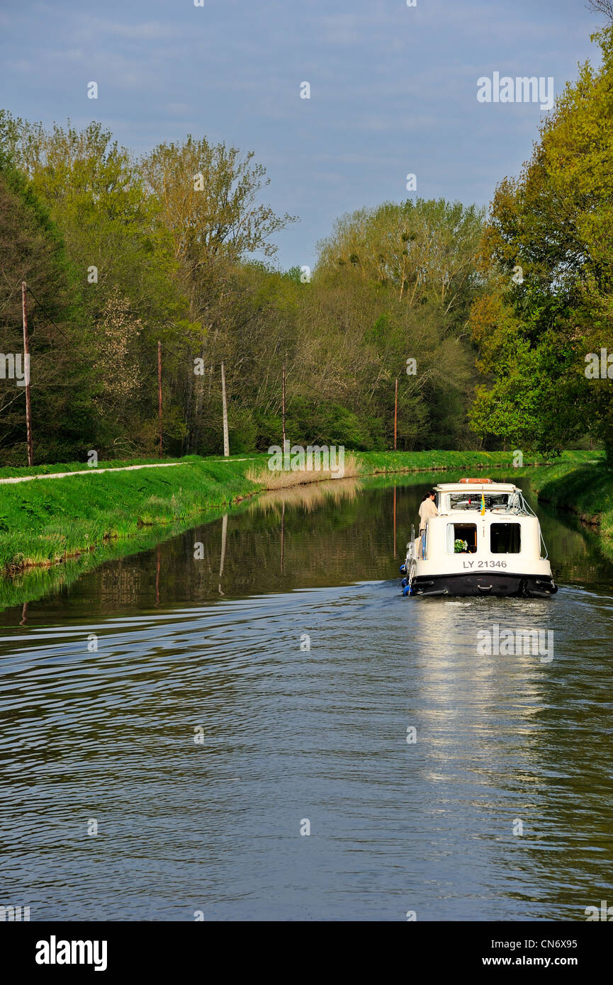 Canal barge on the Yonne River, Canal du Nivernais France. Stock Photo