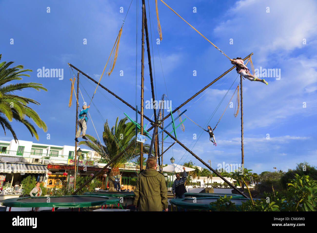 Lanzarote, Canary Islands - bungee bouncer for kids, Costa Teguise main square. Stock Photo