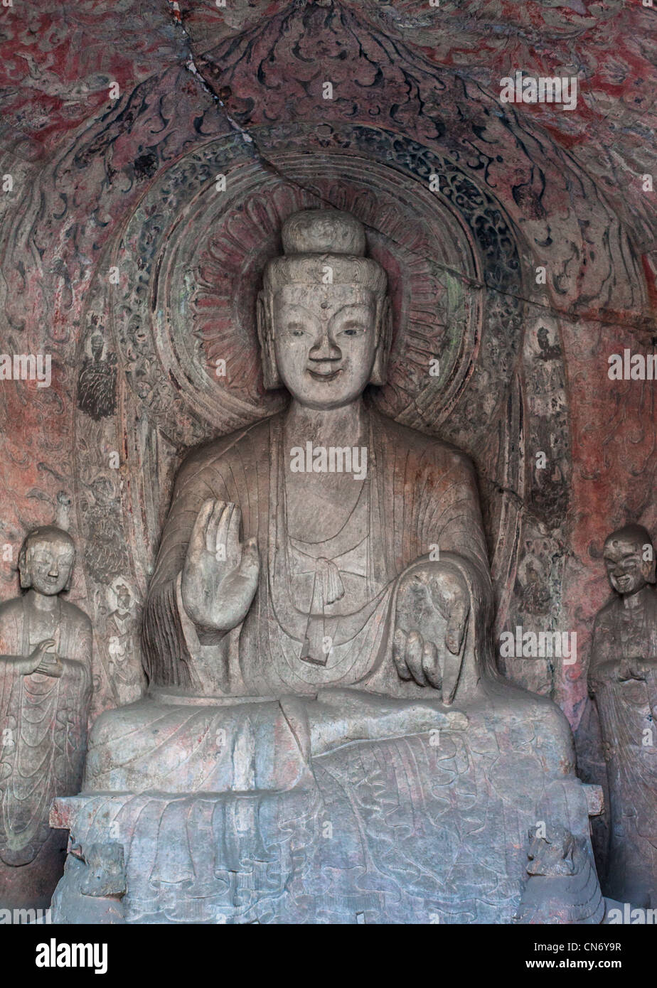 Stone sculptures of Buddha and his disciples at the Middle Binyang cave ...