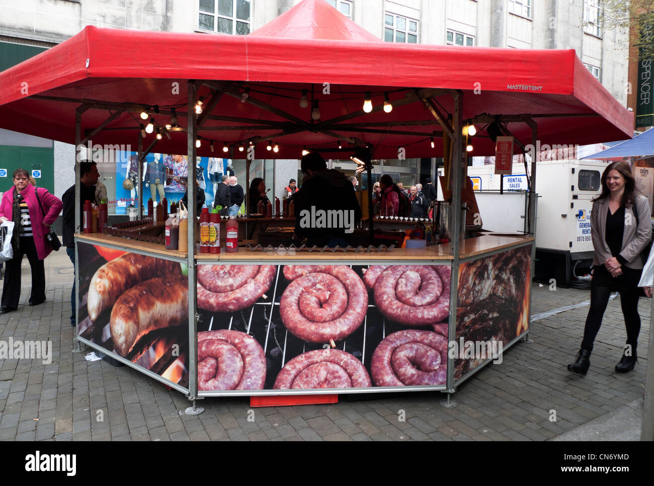 A Swansea street food stall with giant photos display German sausages