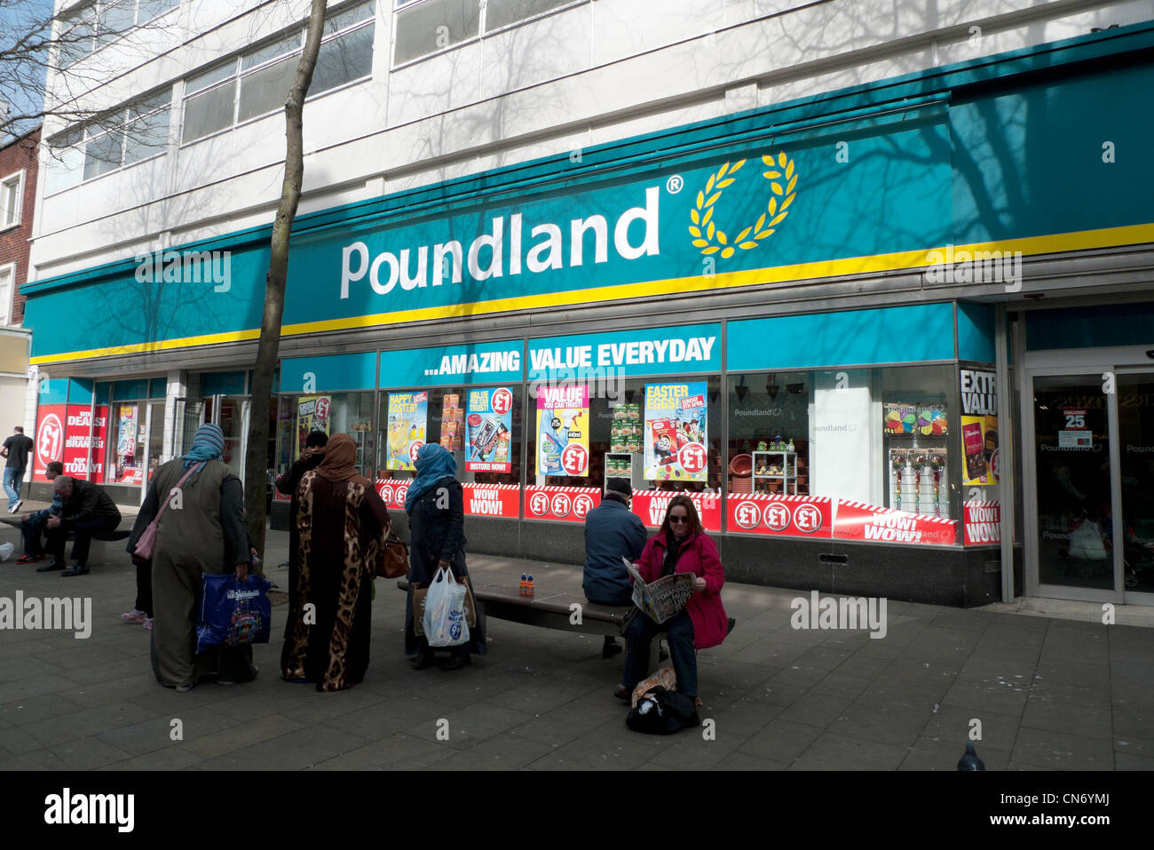 Muslim women shoppers outside Poundland Swansea South Wales UK Stock Photo