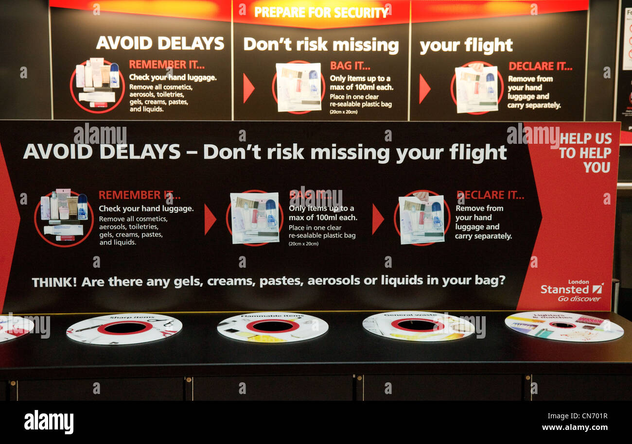 Airport security sign and bins for disallowed items, Stansted airport