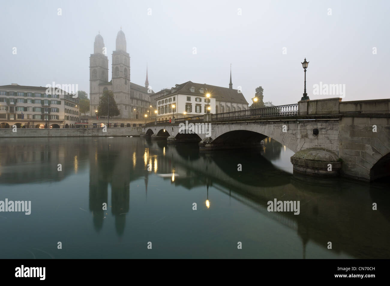 View of Zurich and old city center reflecting in the river Limmat in a foggy morning. Stock Photo