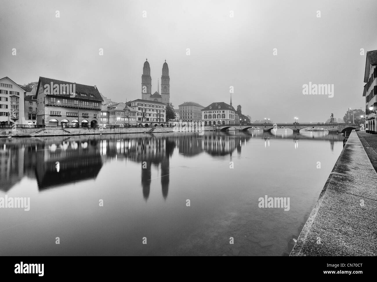View of Zurich old city center in black and white reflecting in the river Limmat. Stock Photo